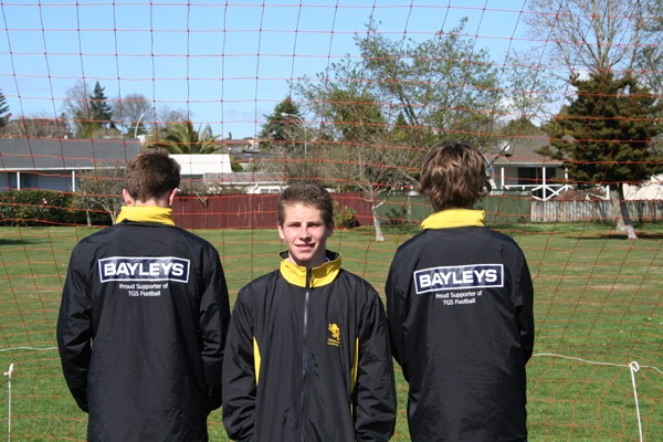 New-look Takapuna Grammar School 1st XV player Jake Phibbs, centre, and team mates model their new Bayleys-sponsored strip. 